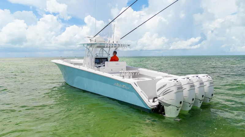 The Image of 2017 SeaHunter 39 Tournament boat with four engines on calm ocean waters. - 0