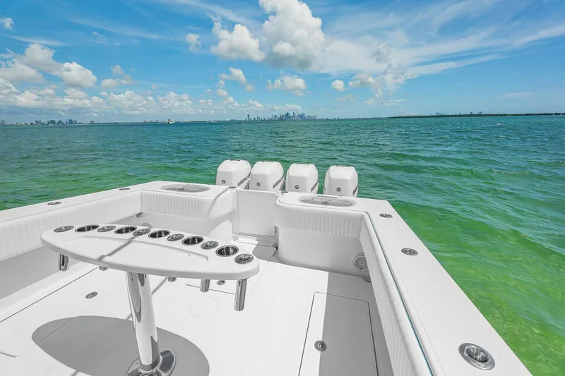 Slide: The Image of 2017 SeaHunter 39 Tournament boat on open water, clear sky, city skyline in distance. - 19