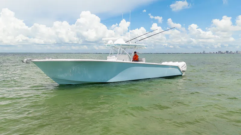 Slide: The Image of 2017 SeaHunter 39 Tournament boat on calm water under a cloudy sky. - 6