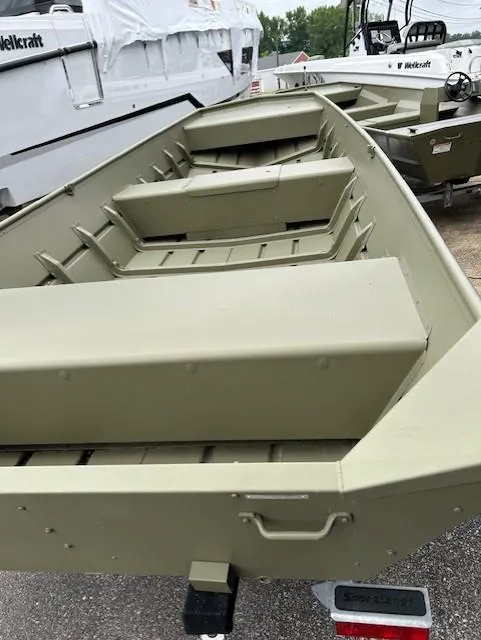 Slide: The Image of 2024 Lund 1648M boat, olive green, parked on trailer, side view. - 6
