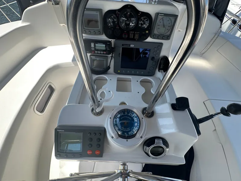 Slide: The Image of Cockpit of 2002 Hunter 410 sailboat with navigation instruments and compass. - 10