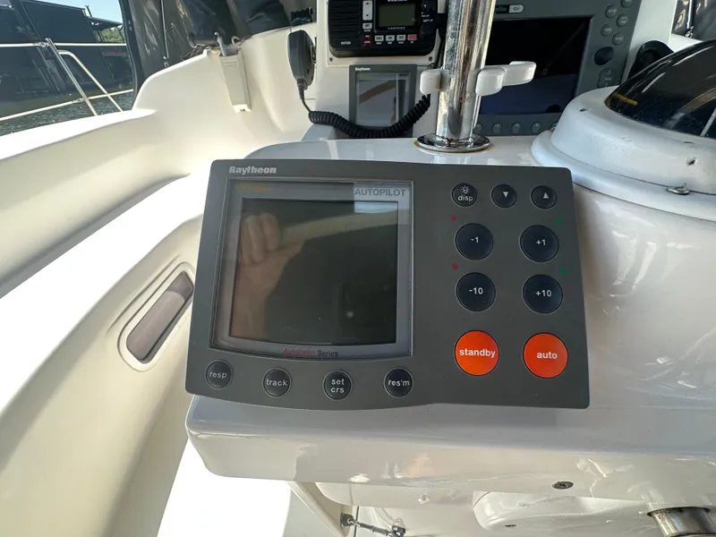 Slide: The Image of Autopilot control panel on a 2002 Hunter 410 sailboat cockpit. - 11