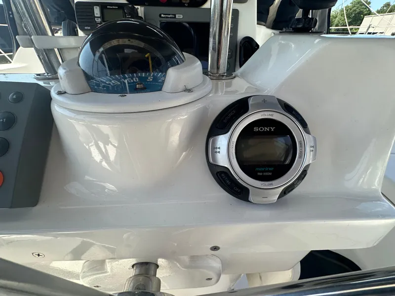 Slide: The Image of Boat dashboard with compass and Sony marine stereo on a 2002 Hunter 410. - 12