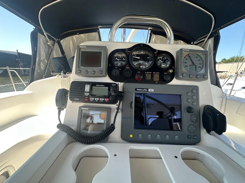Slide: The Image of Control panel of a 2002 Hunter 410 sailboat with navigation instruments and gauges. - 13