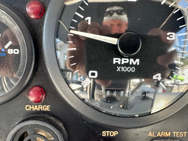 Slide: The Image of Close-up of a 2002 Hunter 410 RPM gauge with reflection. - 14