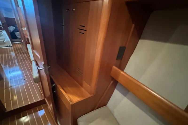 Slide: The Image of Interior of a 2002 Hunter 410 yacht with wooden cabinetry and seating. - 34
