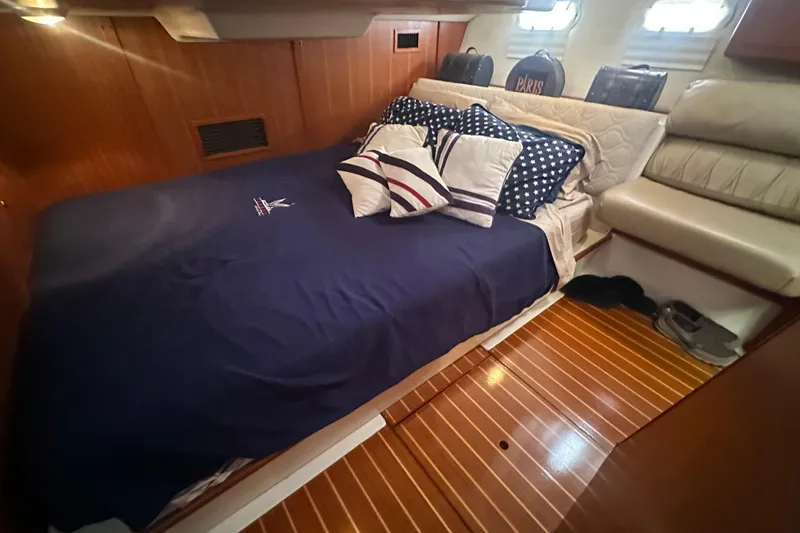 Slide: The Image of Luxurious cabin interior of 2002 Hunter 410 yacht with cozy bedding and wooden flooring. - 45