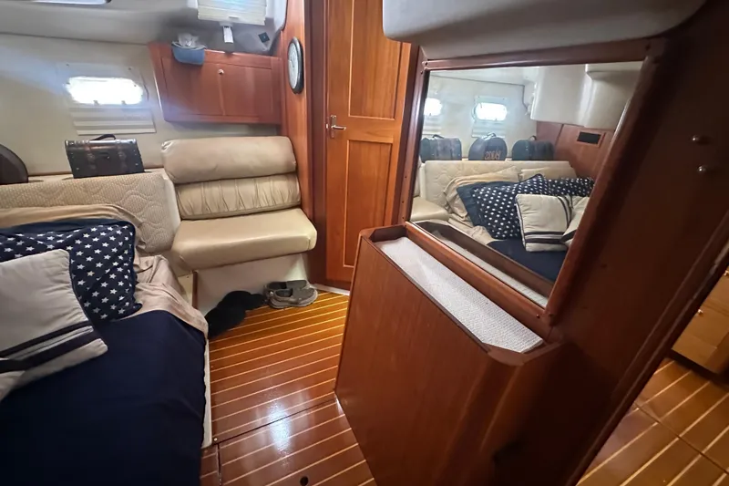 Slide: The Image of Interior of 2002 Hunter 410 yacht with cozy seating and nautical decor. - 47