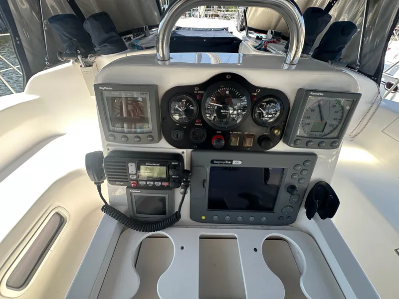 Slide: The Image of Control panel of a 2002 Hunter 410 sailboat with navigation instruments and gauges. - 9