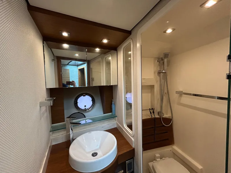 Slide: The Image of Luxurious bathroom in 2015 Tiara Yachts C44 Coupe with modern fixtures and elegant design. - 22