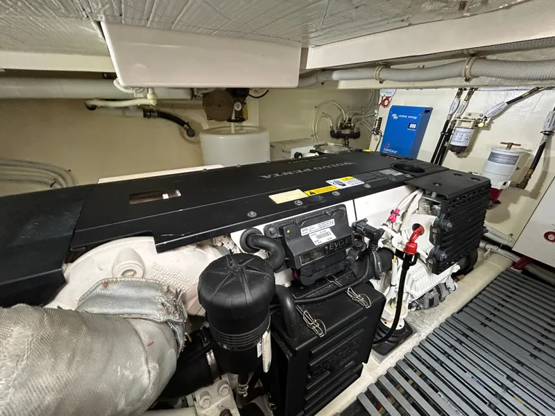 Slide: The Image of Engine room of 2015 Tiara Yachts C44 Coupe, featuring Volvo Penta engine components. - 24