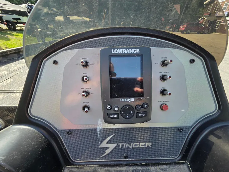 Slide: The Image of Dashboard of a 2018 Lowe 175 Stinger boat with Lowrance electronics. - 12