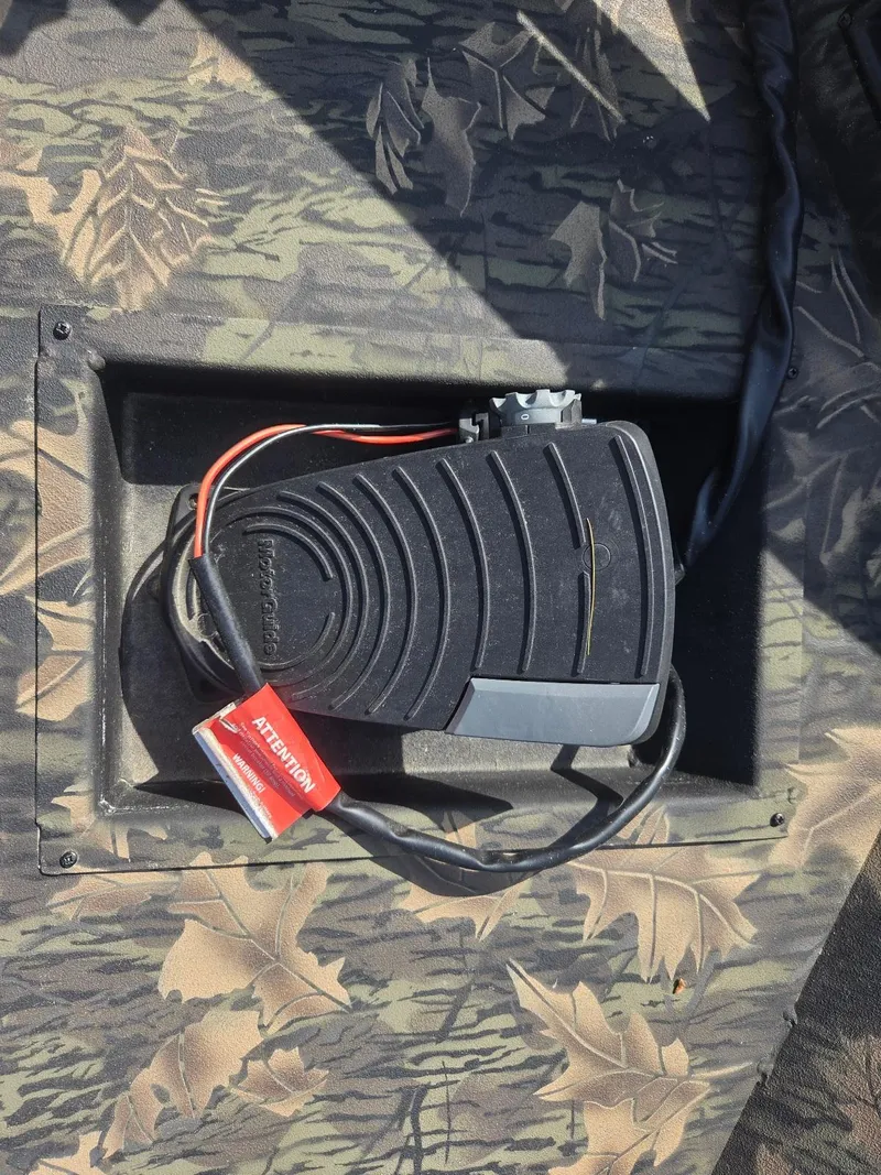 Slide: The Image of Foot pedal on 2018 Lowe 175 Stinger boat with camouflage pattern and attention tag. - 15