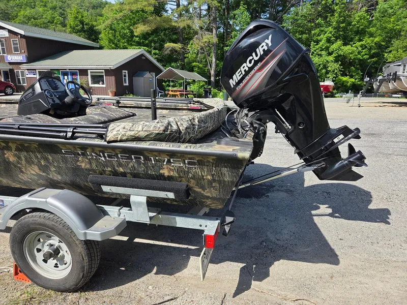 Slide: The Image of 2018 Lowe 175 Stinger boat with Mercury outboard motor on trailer. - 9