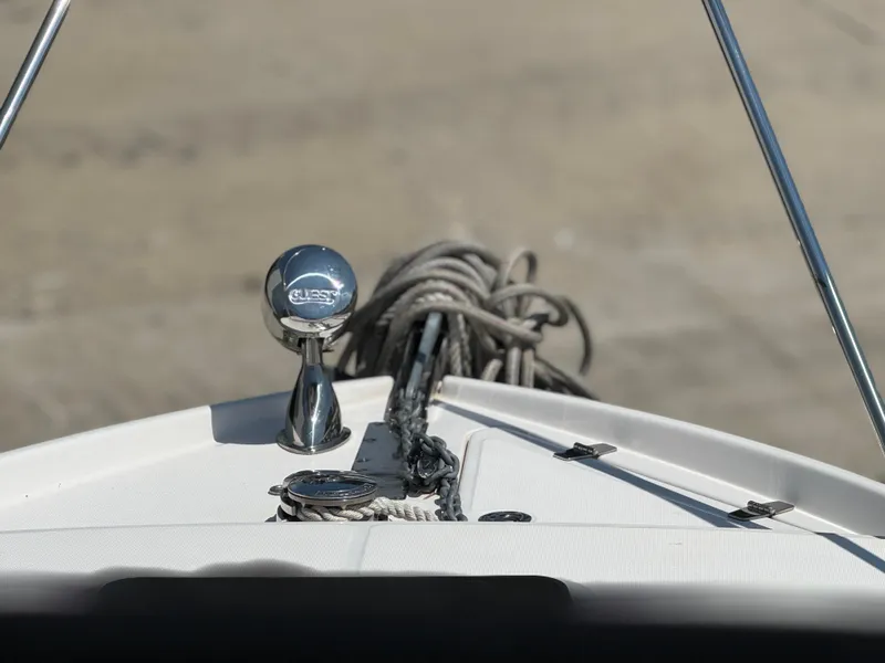 Slide: The Image of Bow of 2006 Regal 2565 Window Express boat with anchor and ropes. - 11