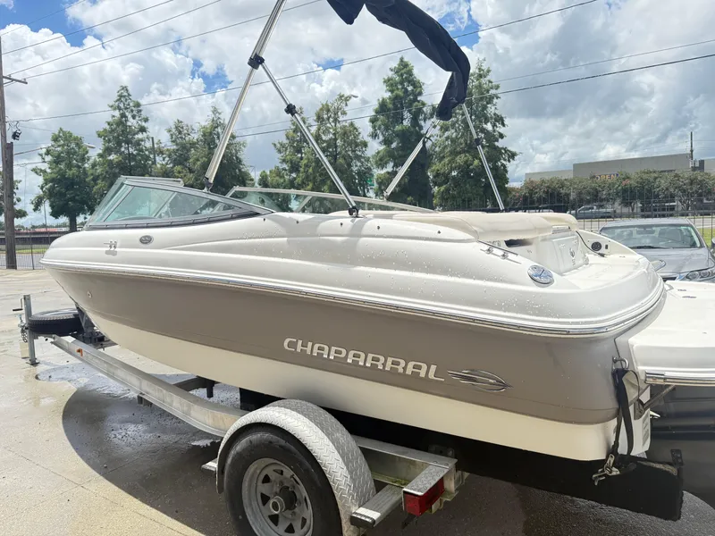 Slide: The Image of 2007 Chaparral 190 SSi boat on trailer, parked outdoors under cloudy sky. - 13