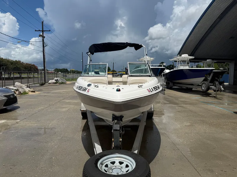 Slide: The Image of 2007 Chaparral 190 SSi boat on trailer, parked outdoors under cloudy sky. - 4