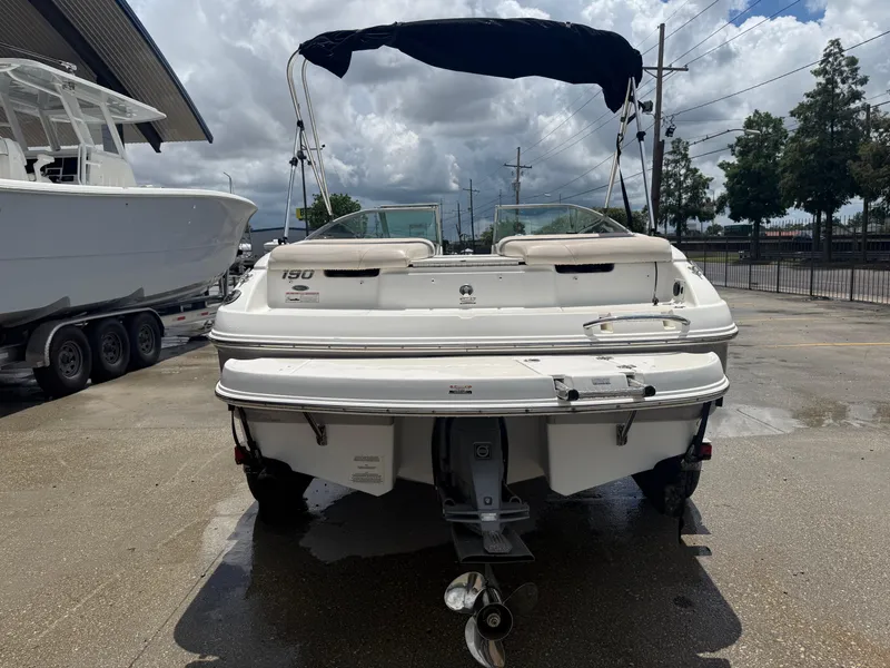 Slide: The Image of 2007 Chaparral 190 SSi boat, rear view, parked outdoors on a cloudy day. - 7