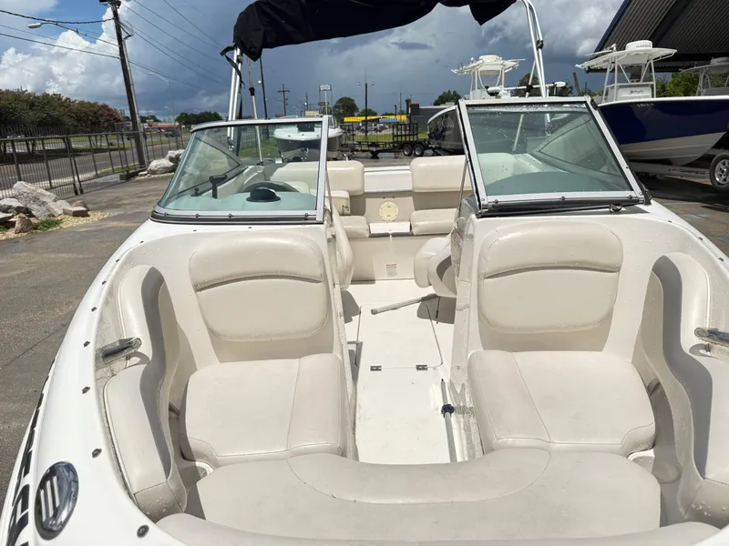 Slide: The Image of 2007 Chaparral 190 SSi boat interior with white seating and open windshield. - 9