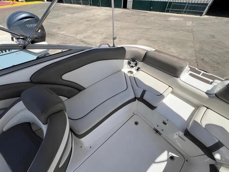 Slide: The Image of 2012 Yamaha Boats 242 Limited interior with cushioned seating and sleek design. - 11