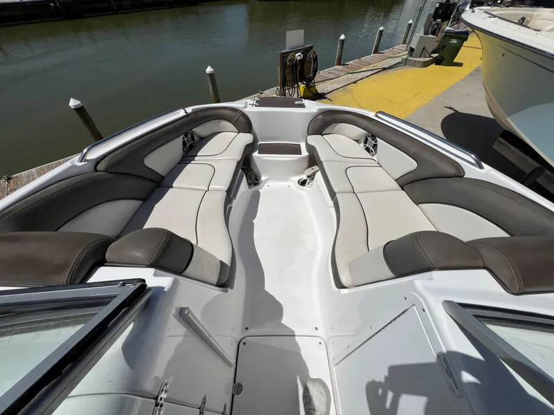Slide: The Image of 2012 Yamaha Boats 242 Limited interior with spacious seating at dockside. - 13