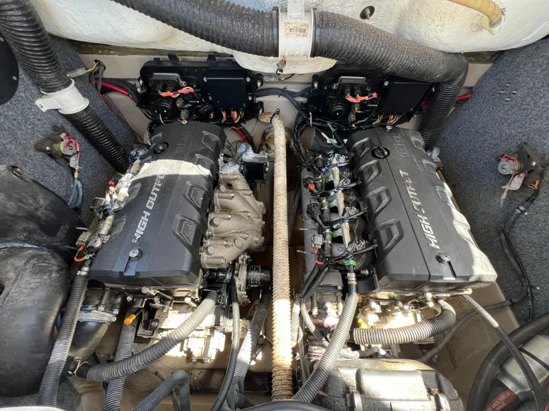 Slide: The Image of Engine compartment of a 2012 Yamaha Boats 242 Limited, featuring dual high-output engines. - 14