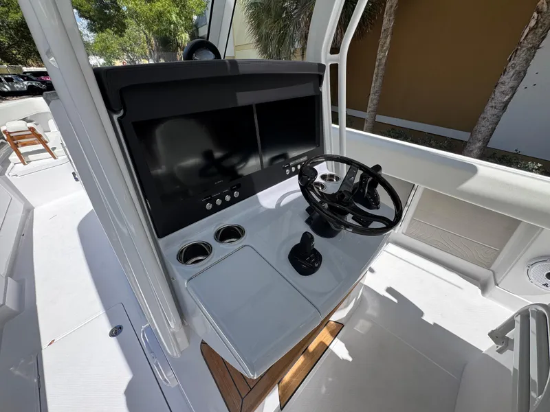Slide: The Image of 2025 Jupiter 380LS boat helm with dual screens and modern controls. - 12