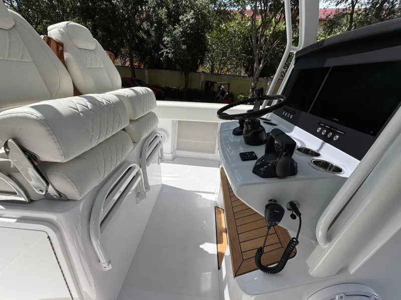 Slide: The Image of Luxurious interior of 2025 Jupiter 380LS boat with plush seating and advanced controls. - 16
