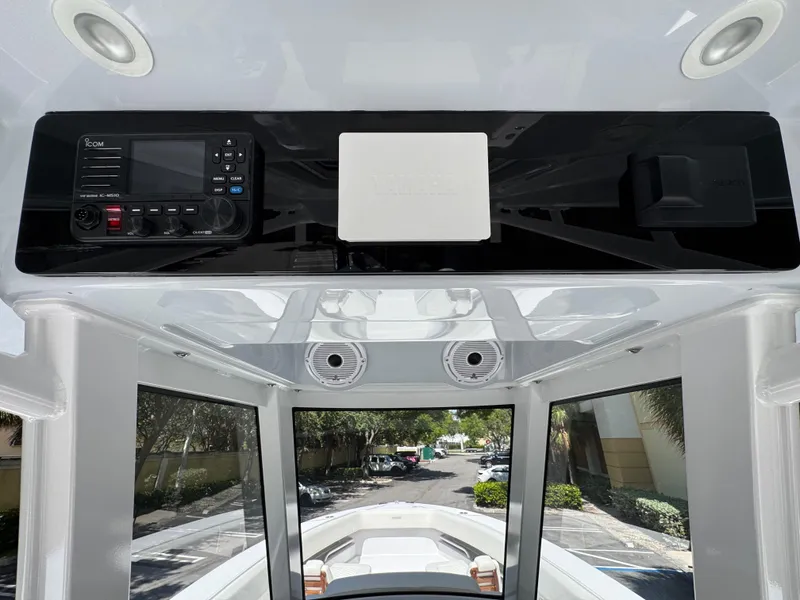 Slide: The Image of 2025 Jupiter 380LS boat interior with control panel and navigation equipment. - 18