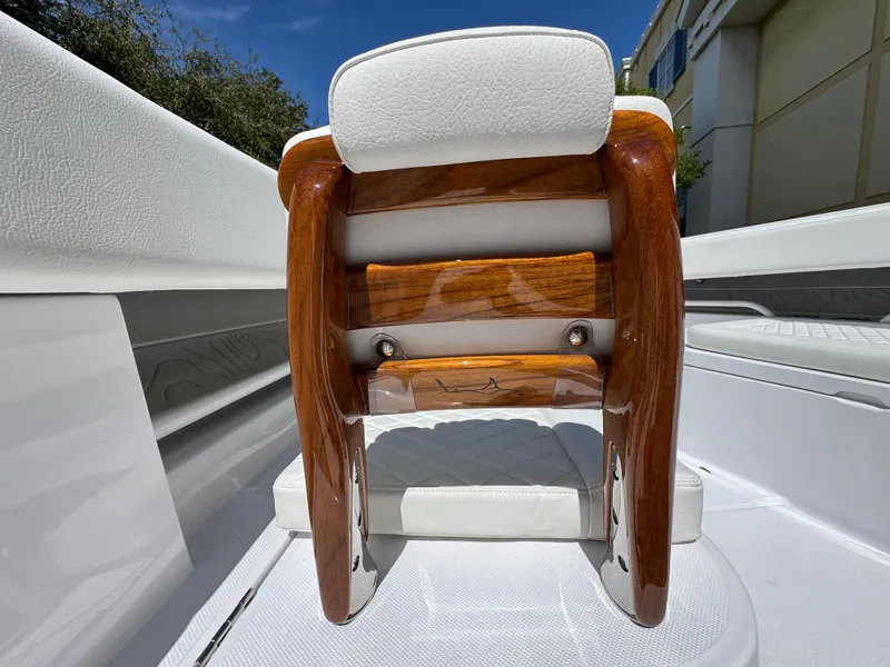 Slide: The Image of Luxury seating on 2025 Jupiter 380LS boat, featuring polished wood and white upholstery. - 6