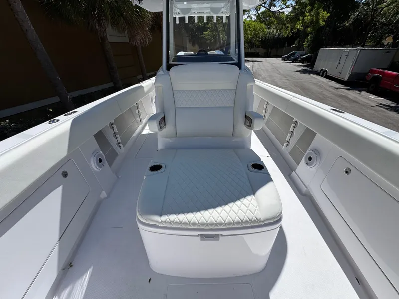 Slide: The Image of 2025 Jupiter 380LS boat interior with white seating and storage compartments. - 8