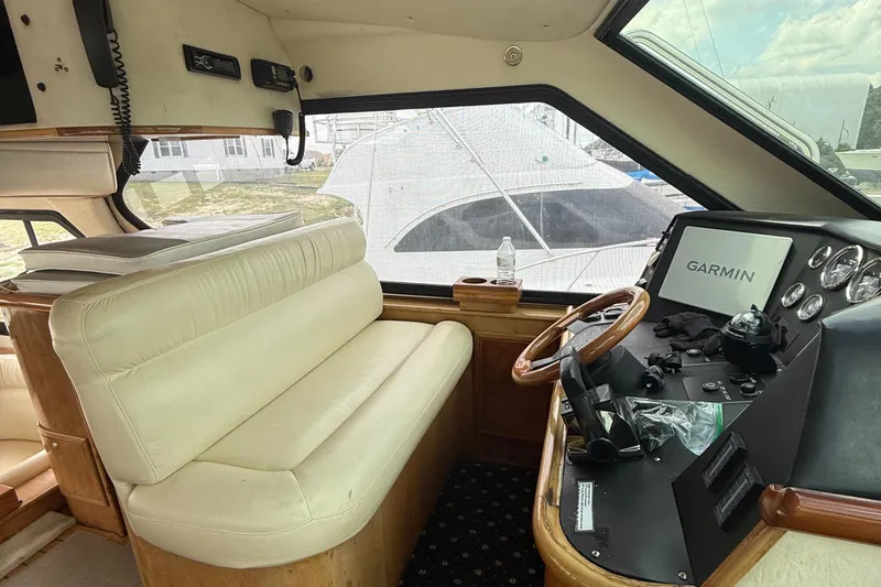 Slide: The Image of Interior of 2001 Custom Sports Catamaran 44 with Garmin navigation system and leather seating. - 9