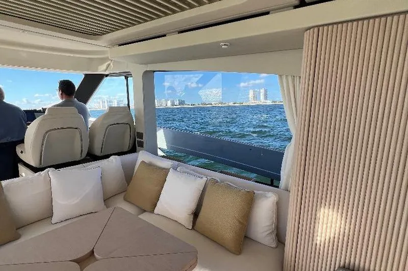 Slide: The Image of Luxurious interior of 2025 Azimut SeaDeck6 yacht with ocean view and plush seating. - 12