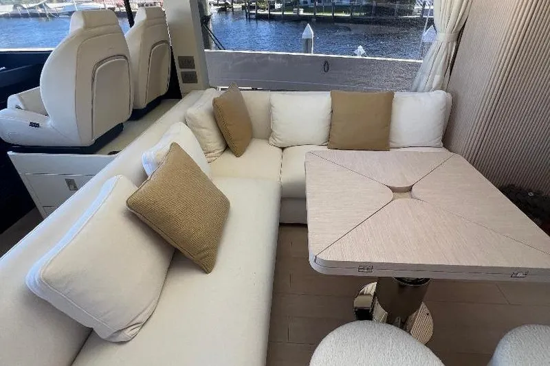 Slide: The Image of Luxurious interior of 2025 Azimut SeaDeck6 yacht with elegant seating and table. - 13
