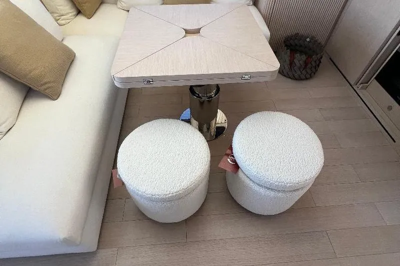 Slide: The Image of Interior of 2025 Azimut SeaDeck6 yacht with modern table and plush seating. - 14