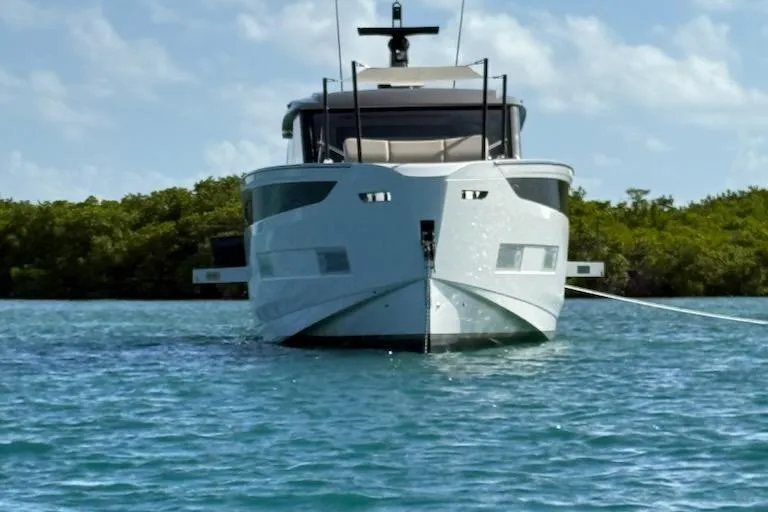 Slide: The Image of 2025 Azimut SeaDeck6 yacht anchored in serene blue waters, front view. - 3