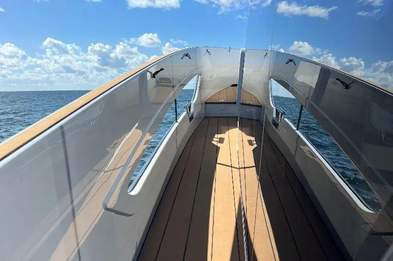 Slide: The Image of 2025 Azimut SeaDeck6 yacht deck with ocean view and clear skies. - 7