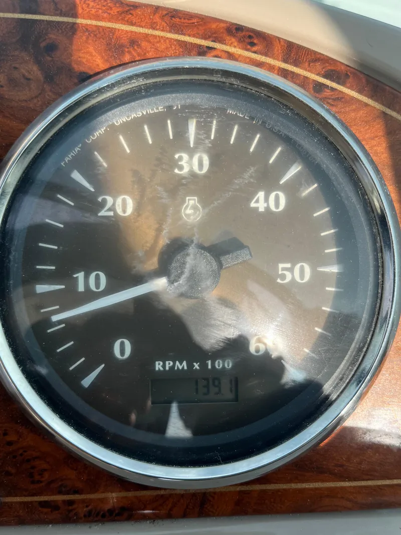 Slide: The Image of Close-up of a 2003 Maxum 3300 SCR tachometer showing 1391 RPM. - 26