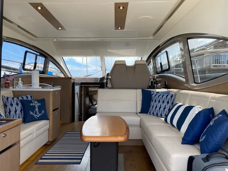 Slide: The Image of Luxurious interior of 2018 Sea Ray 400 Fly yacht with elegant seating and nautical decor. - 10
