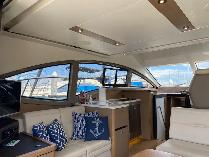 Slide: The Image of Interior of 2018 Sea Ray 400 Fly yacht with modern furnishings and nautical decor. - 11