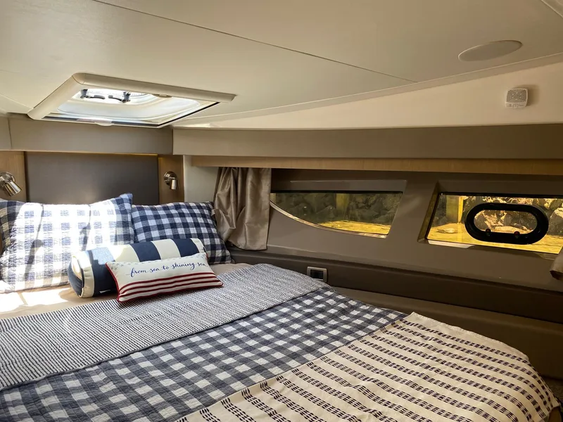 Slide: The Image of Luxurious cabin interior of 2018 Sea Ray 400 Fly yacht with cozy bedding. - 25