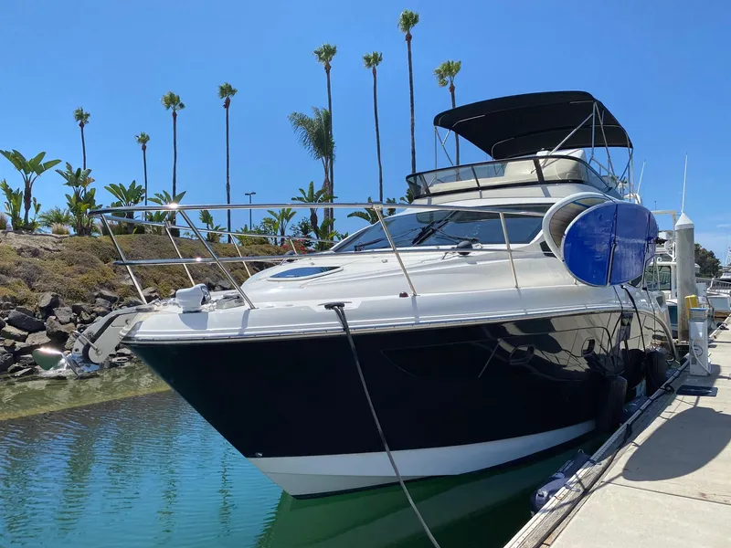 Slide: The Image of 2018 Sea Ray 400 Fly yacht docked in sunny marina with palm trees. - 3