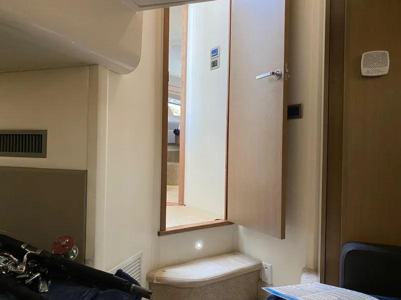 Slide: The Image of Interior of 2018 Sea Ray 400 Fly yacht, featuring a doorway and steps. - 31
