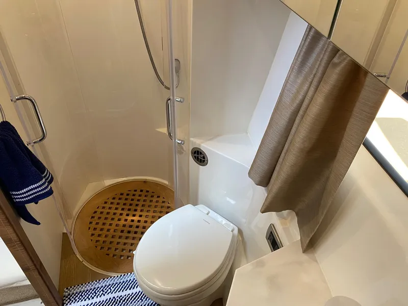 Slide: The Image of Bathroom interior of 2018 Sea Ray 400 Fly yacht with shower and toilet. - 33