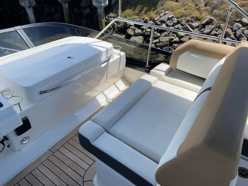 Slide: The Image of 2018 Sea Ray 400 Fly yacht interior with sleek seating and modern design. - 38