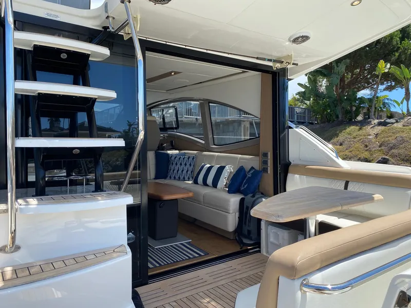 Slide: The Image of Luxurious 2018 Sea Ray 400 Fly yacht interior with elegant seating and modern design. - 5