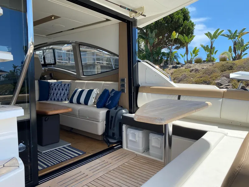 Slide: The Image of Luxurious 2018 Sea Ray 400 Fly yacht interior with elegant seating and modern design. - 7