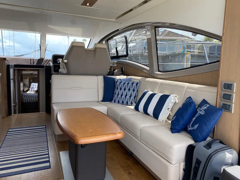 Slide: The Image of Luxurious interior of 2018 Sea Ray 400 Fly yacht with elegant seating and nautical decor. - 9