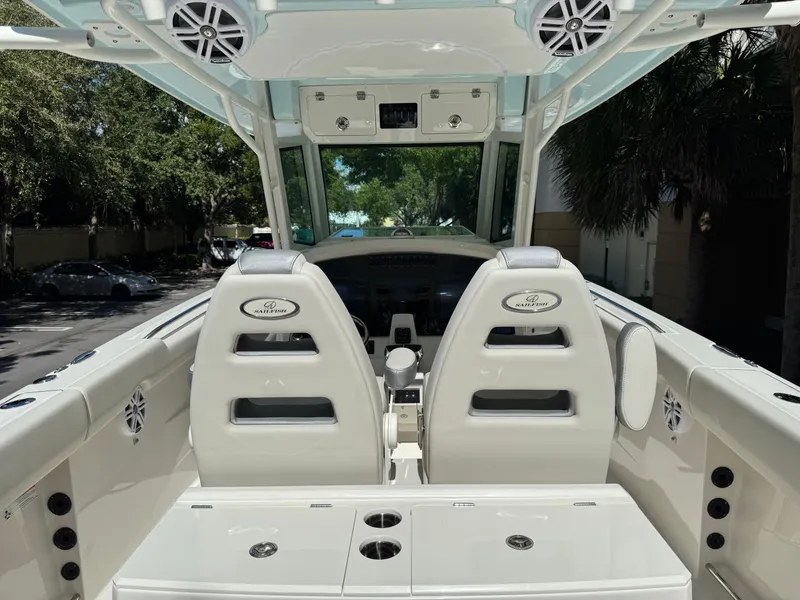Slide: The Image of 2026 Sailfish 312 CC boat interior with dual seats and modern dashboard. - 21