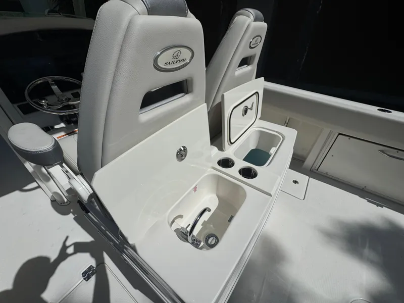 Slide: The Image of Interior of 2026 Sailfish 312 CC boat with seating and storage compartments. - 23